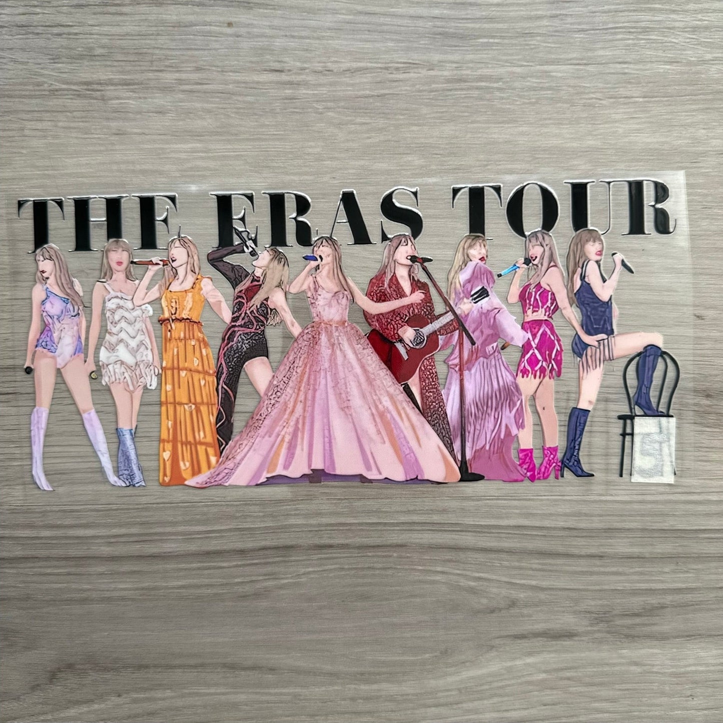 Taylor Swift Eras Tour wrap, with Taylor in each of the eras outfits. This looks like more of an artsy style