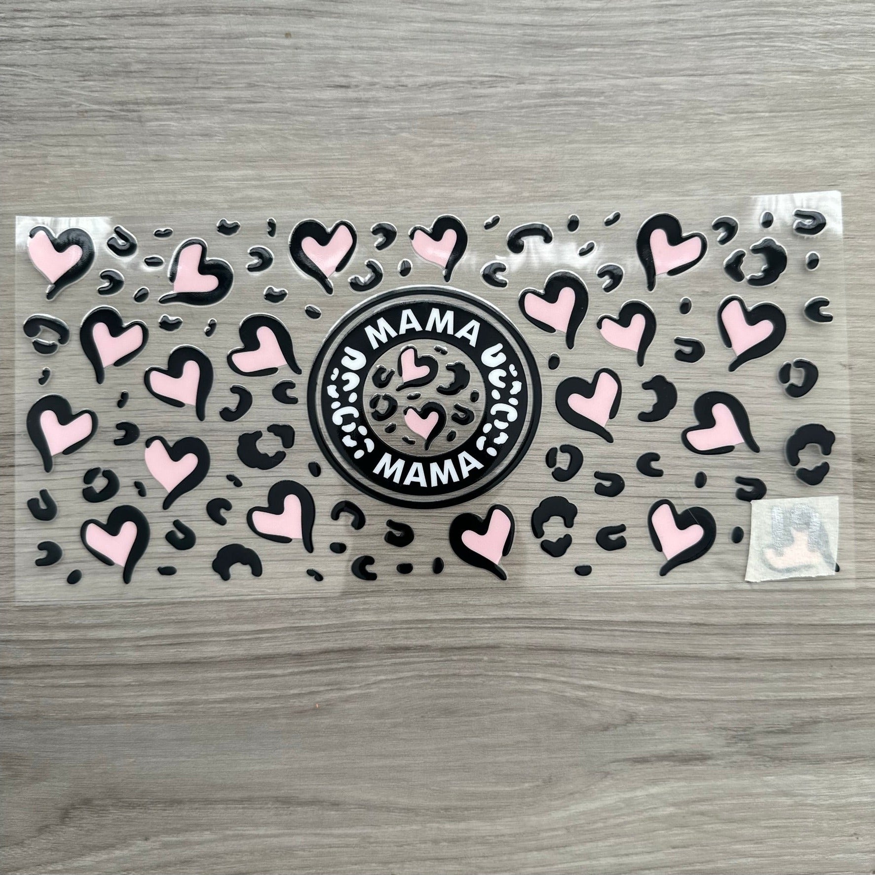 A Mama wrap with pink hearts and black cheetah print designs