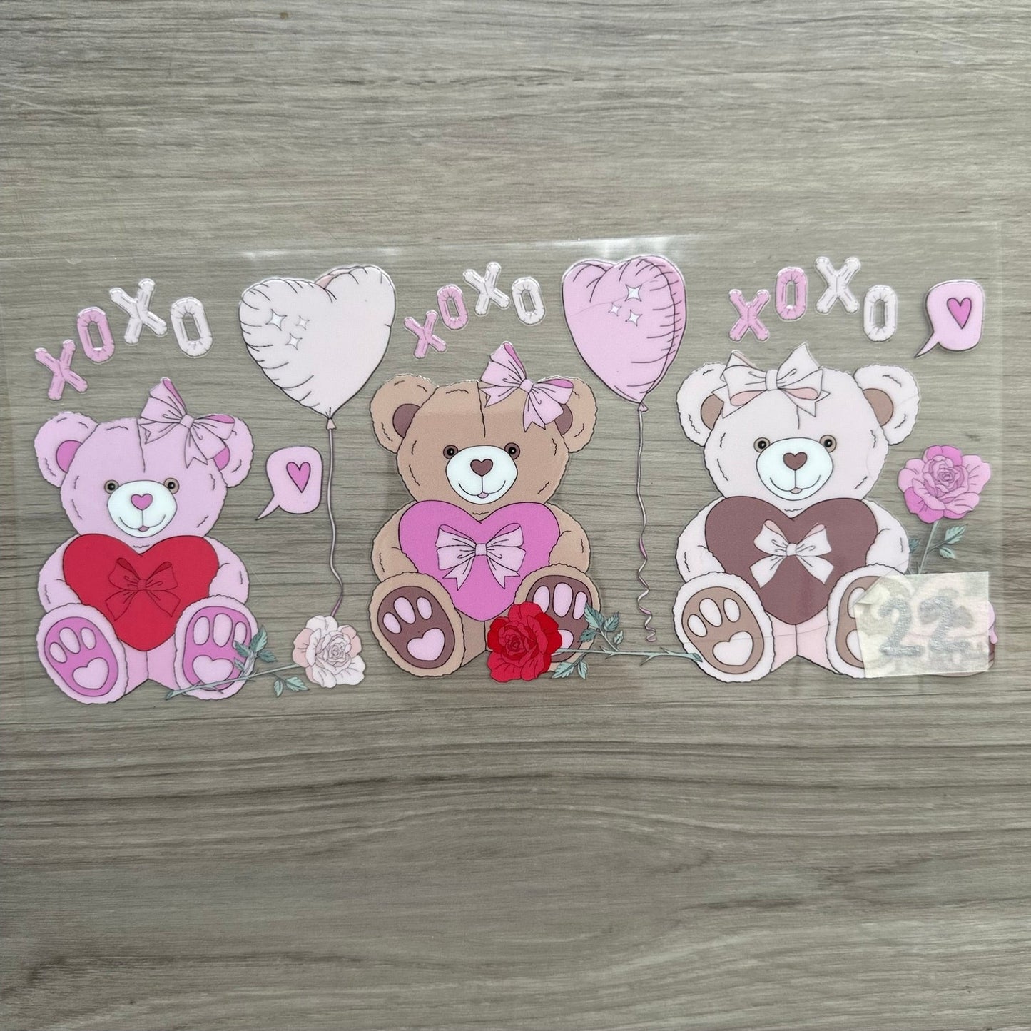 3 Valentines Day Bears side by side, with xoxo, heart balloons and roses for decoration