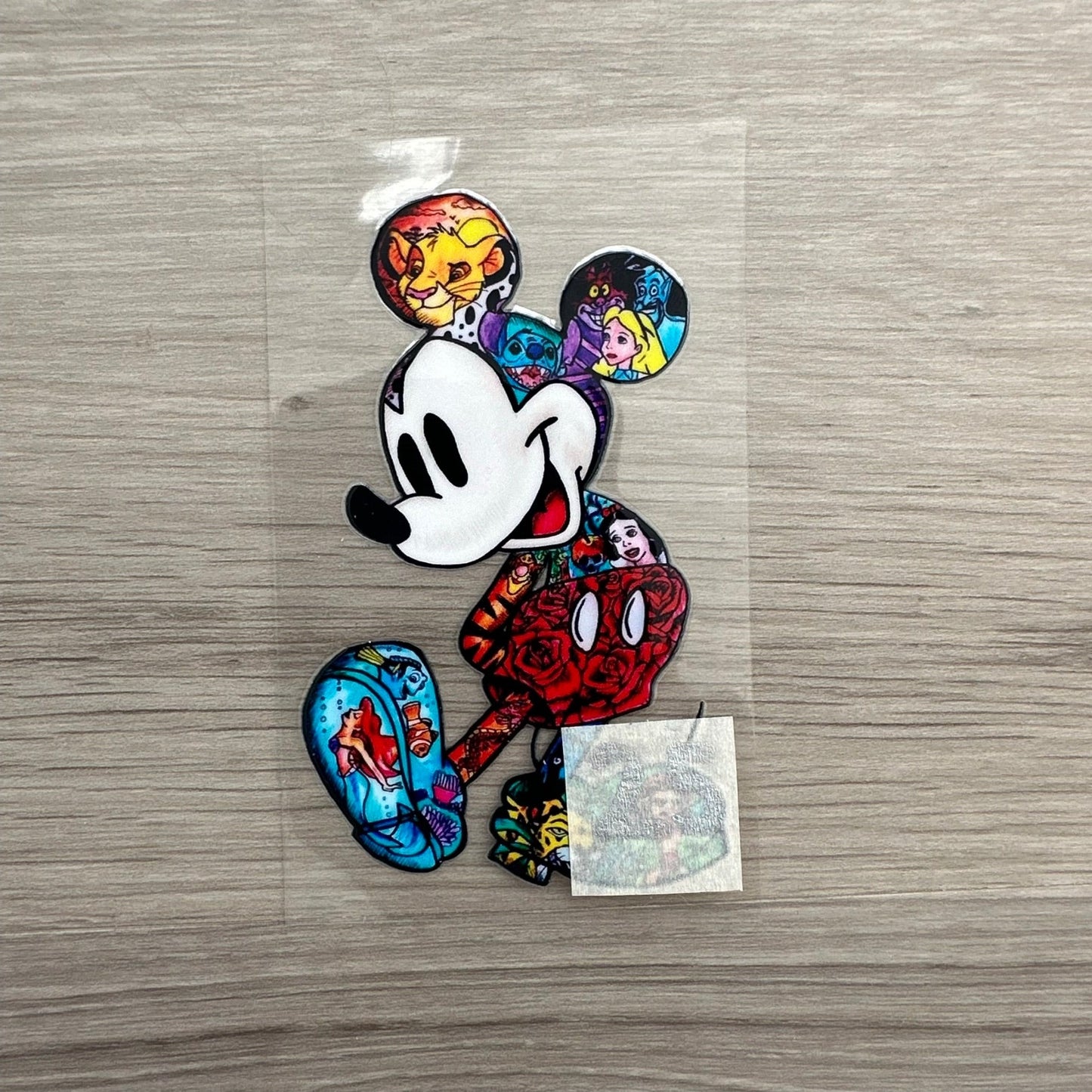 A mickey mouse decal, but the mickey mouse has all of the other disney characters inside it